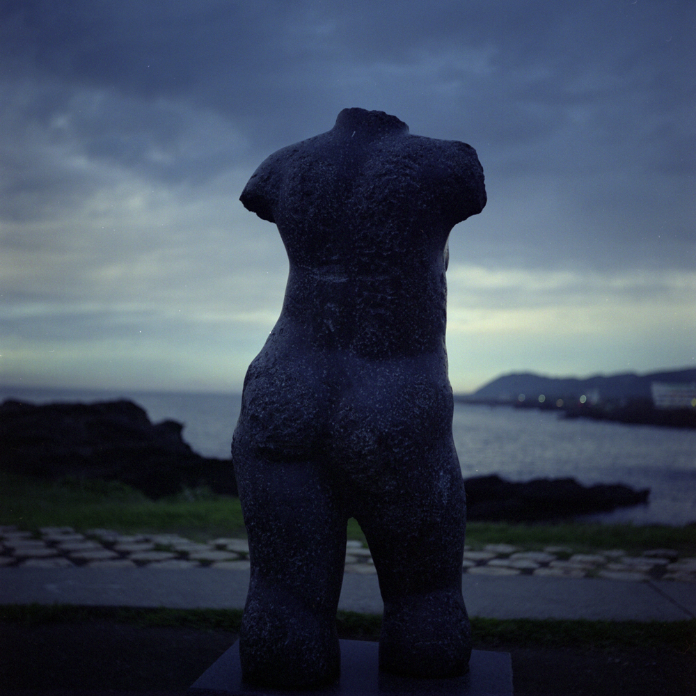 A-bronze-statue-with-no-head-that-faces-the-sea